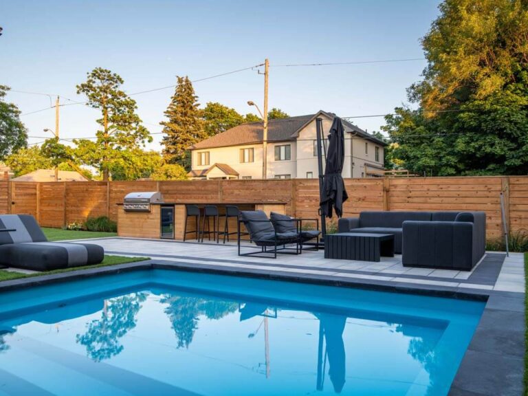 Elegant backyard with a wooden deck and garden elements