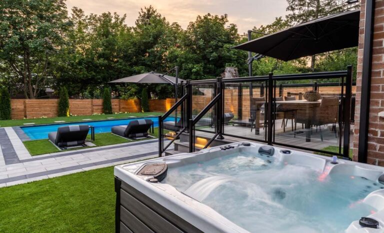 Backyard with a modern patio, garden, and decorative lighting