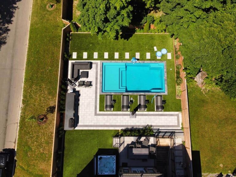 Stylish backyard with outdoor seating and a decorative garden