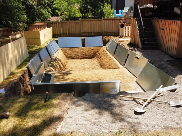Backyard area with stone pathway and vibrant plants