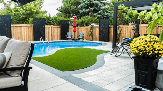 Completed landscape project showcasing a water feature and plants