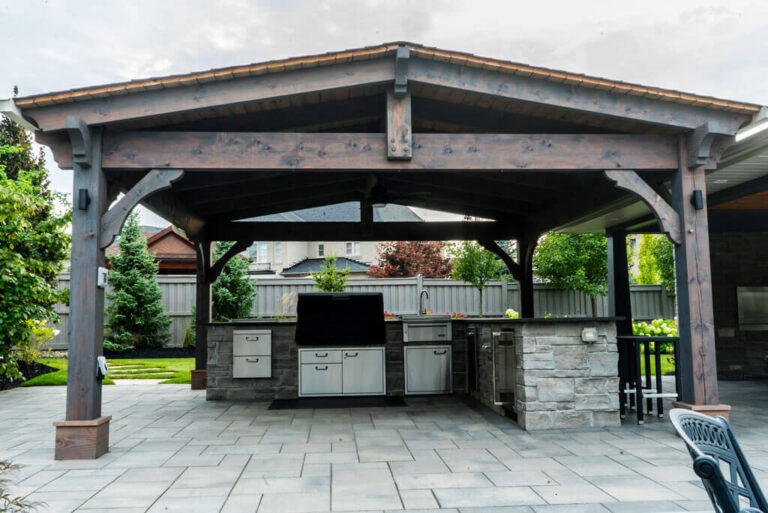 Stone walkway leading to a modern house entrance
