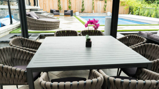 Backyard garden with lush greenery and stone accents