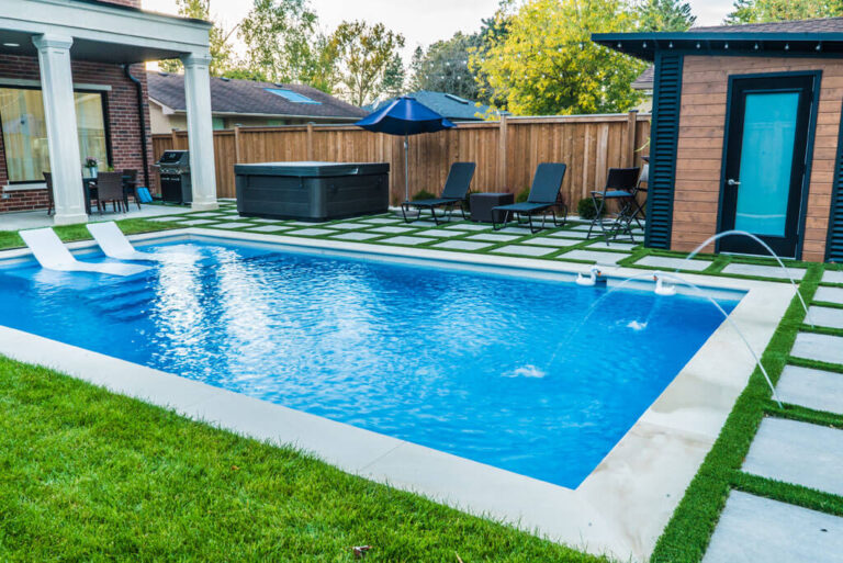 Stone retaining wall and flower beds in a landscaped yard