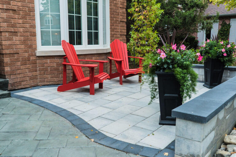 Landscaped garden with a patio and wooden furniture