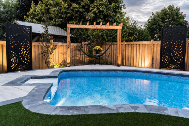 Backyard landscaping with a focus on greenery and stone paths