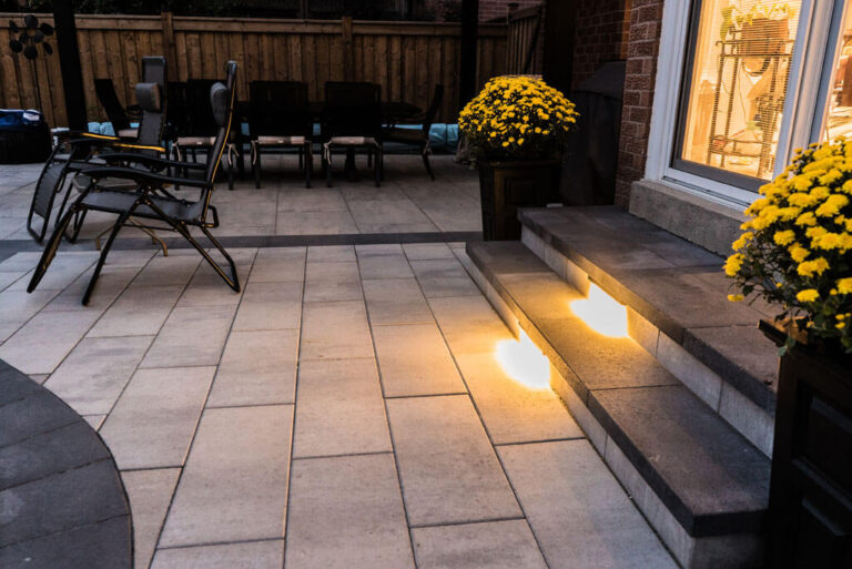 Close-up view of the landscaped backyard with a stone path