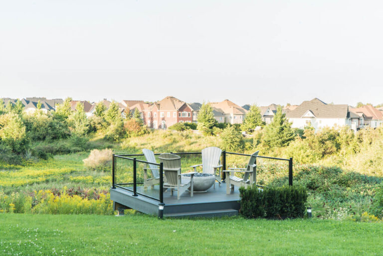 Chic backyard space with water feature and modern furniture