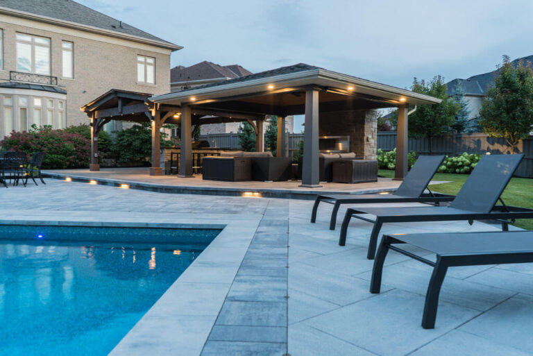 Wooden deck with seating area overlooking a landscaped backyard