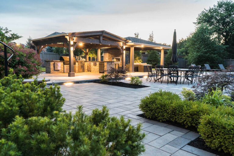 Custom-built wooden deck with glass railing and outdoor furniture