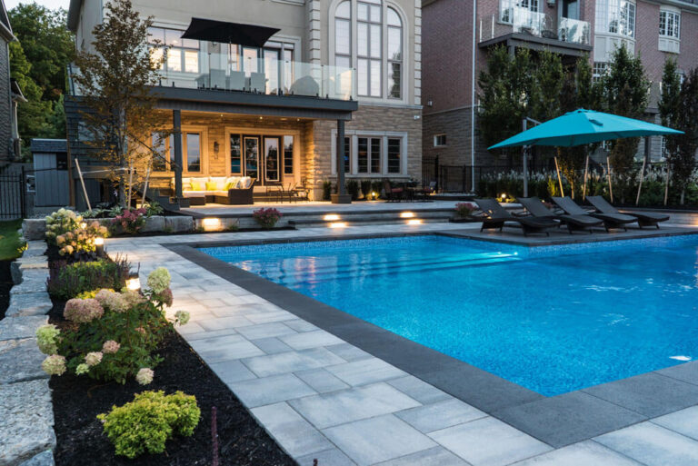 Outdoor dining area with a wooden table and stylish chairs