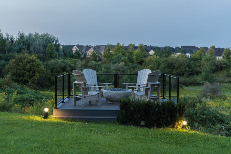 Luxurious swimming pool with lounge chairs and surrounding greenery