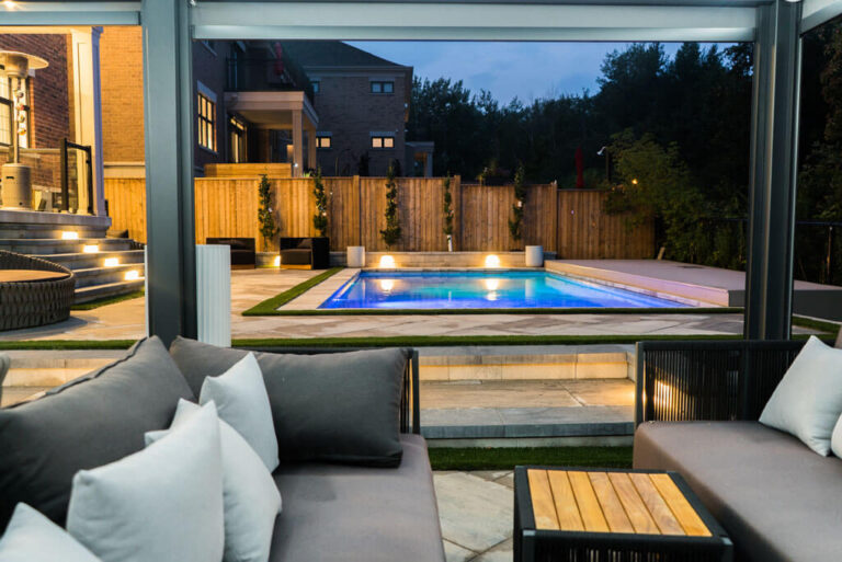 Night view of illuminated swimming pool and garden