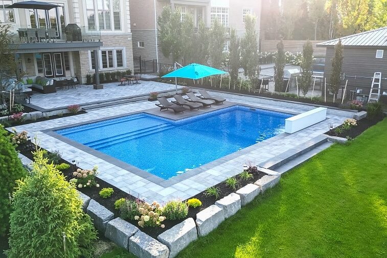 How Landscaping Affects Pool Design (Why They Should Be Planned Together)