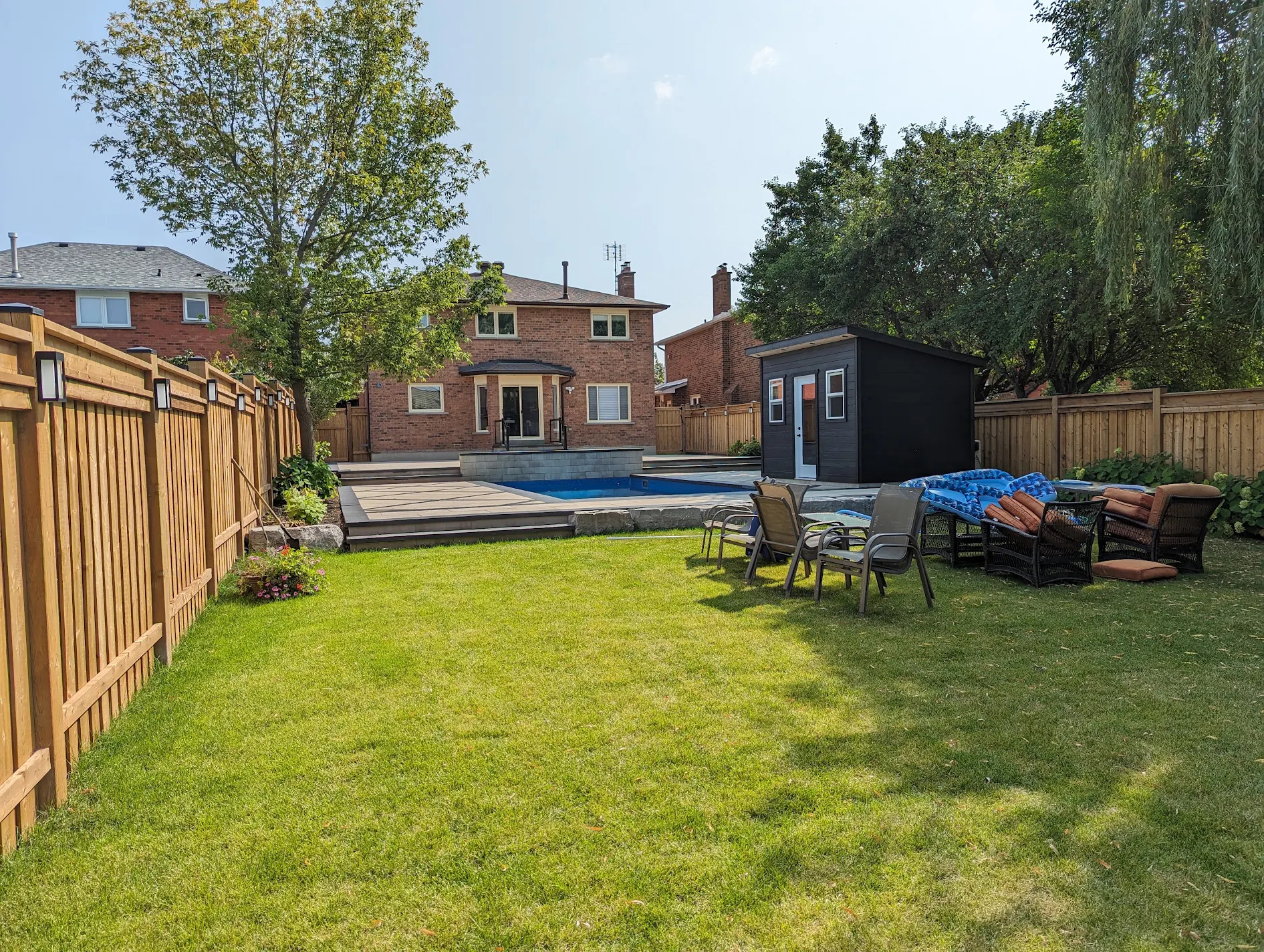 Full backyard landscaping and pool installation by Land-Con in Toronto