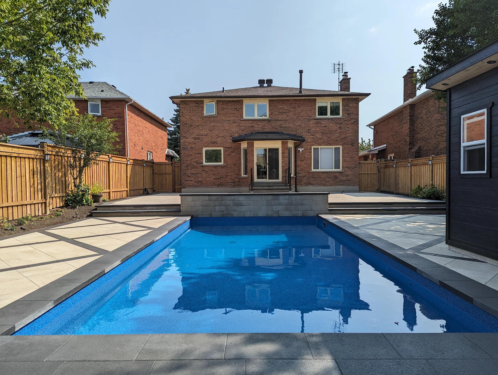 Complete backyard pool transformation by Land-Con in Toronto